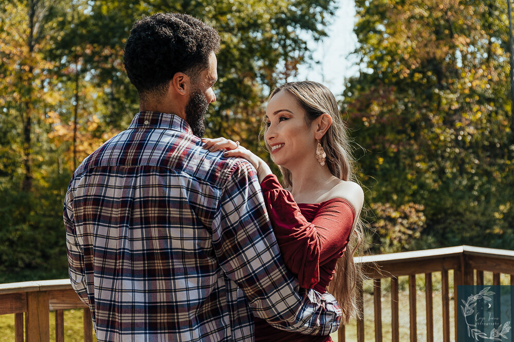 newly engaged couple shares a dance.