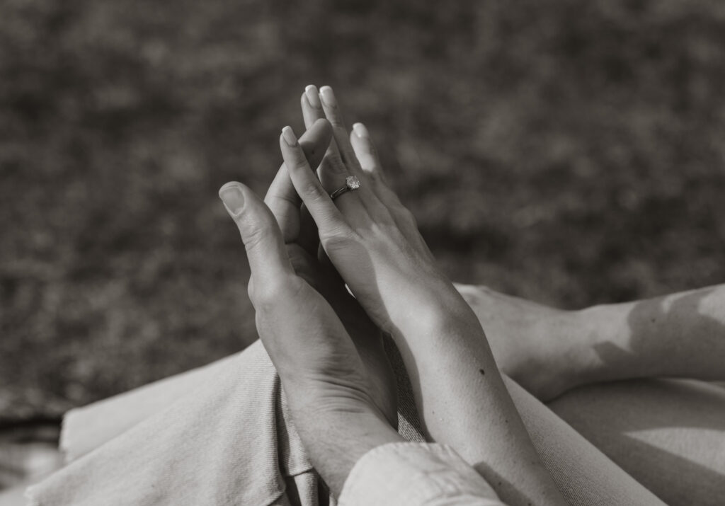 close up of brides ring and hands. black and white photography.