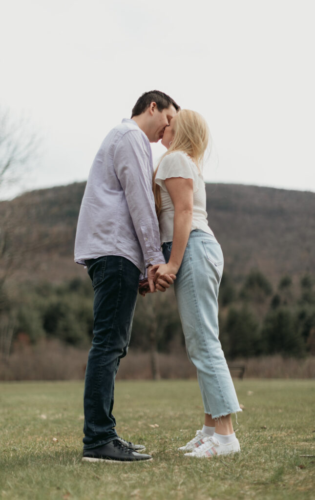 Engagement Session at Kenneth L. Wilson Campground. Woodstock, NY. couple walking away from camera. beautiful landscape, couple shares a kiss