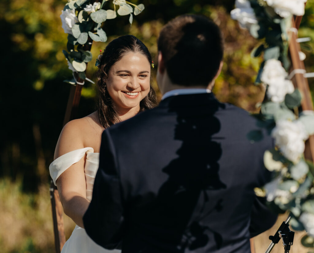 bride smiling lovingly at her groom