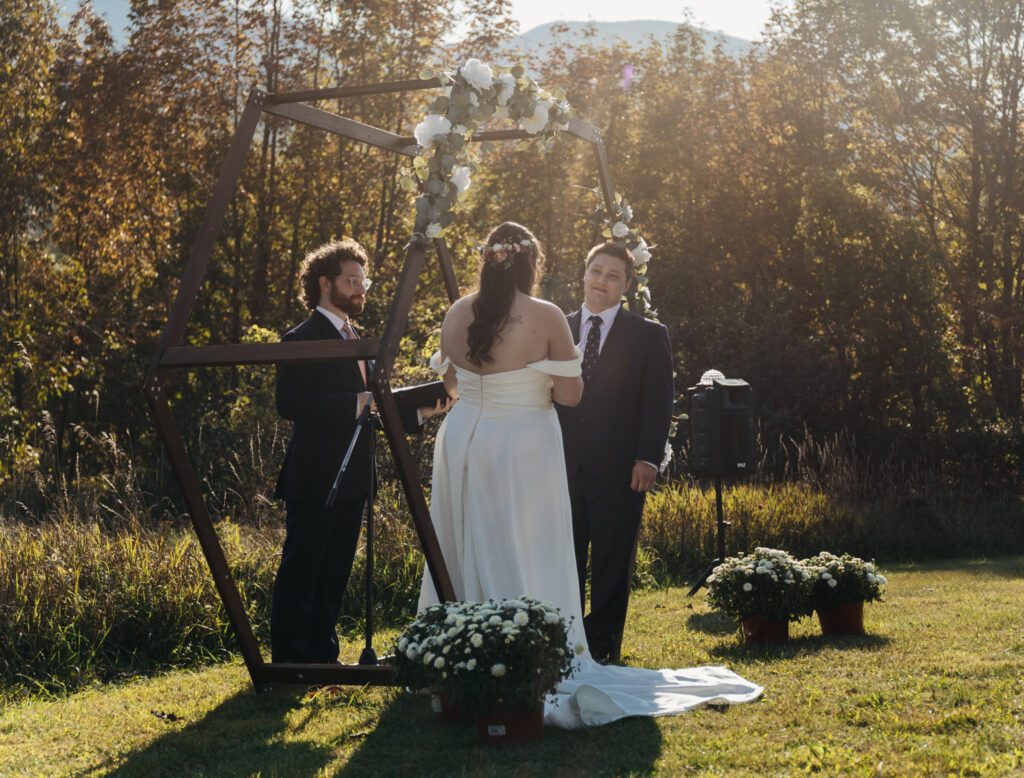 golden light shot of couple at altar