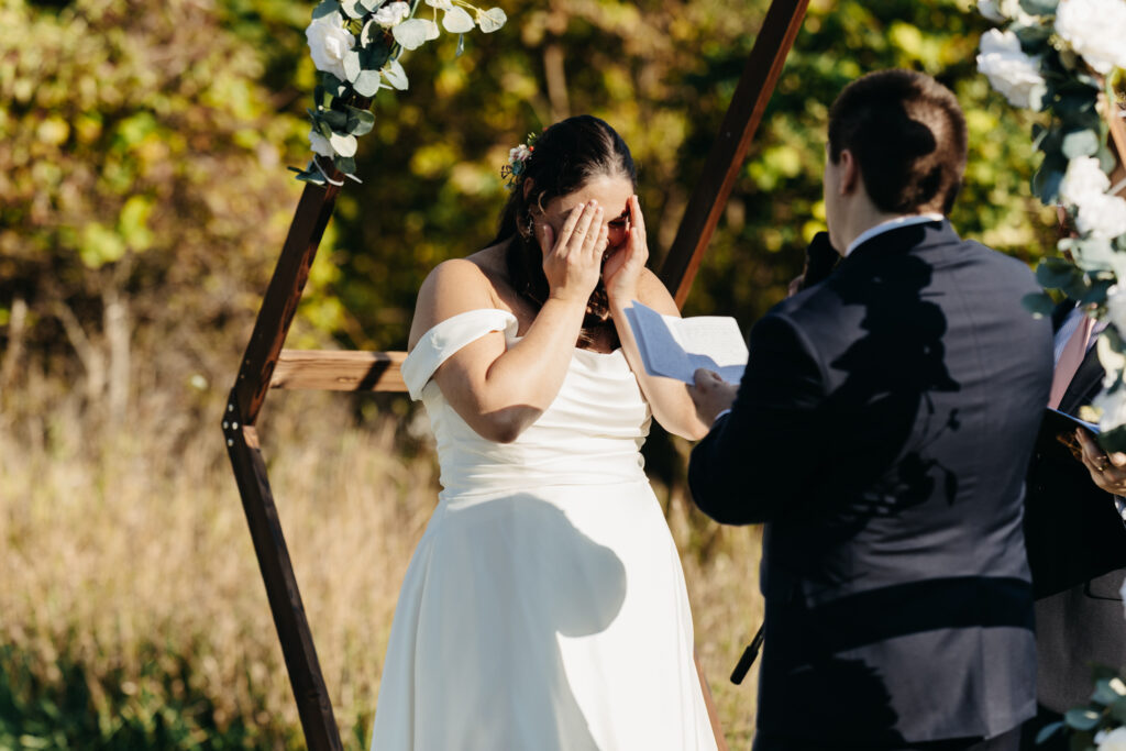 bride beginning to cry during exchange of vows