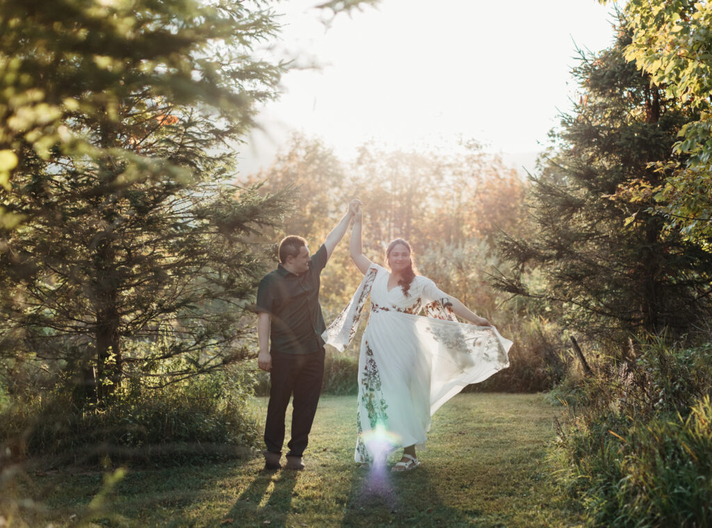 bride swings her dress whilw she dances with groom