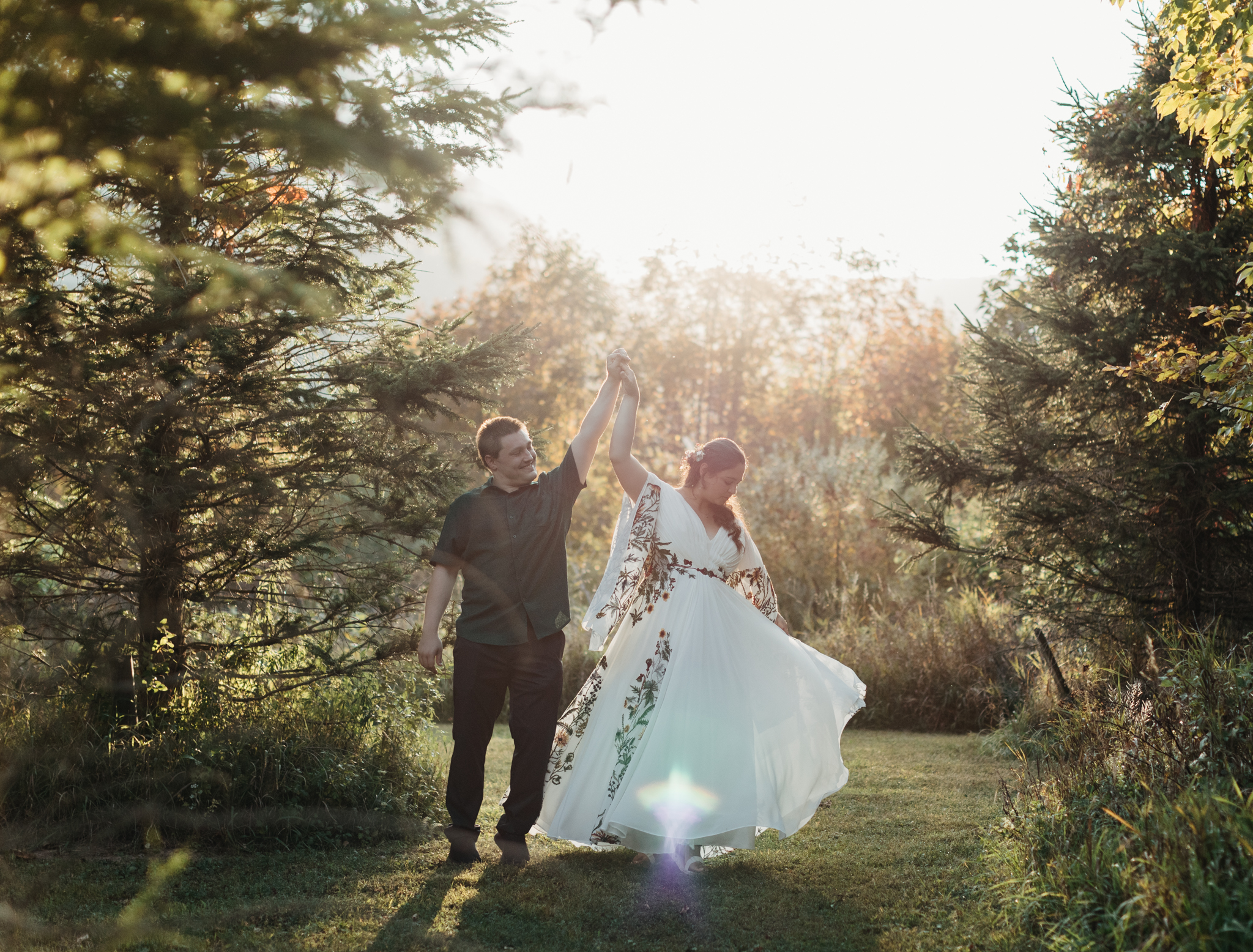 couple dancing during golden hour at wedding in round top new york