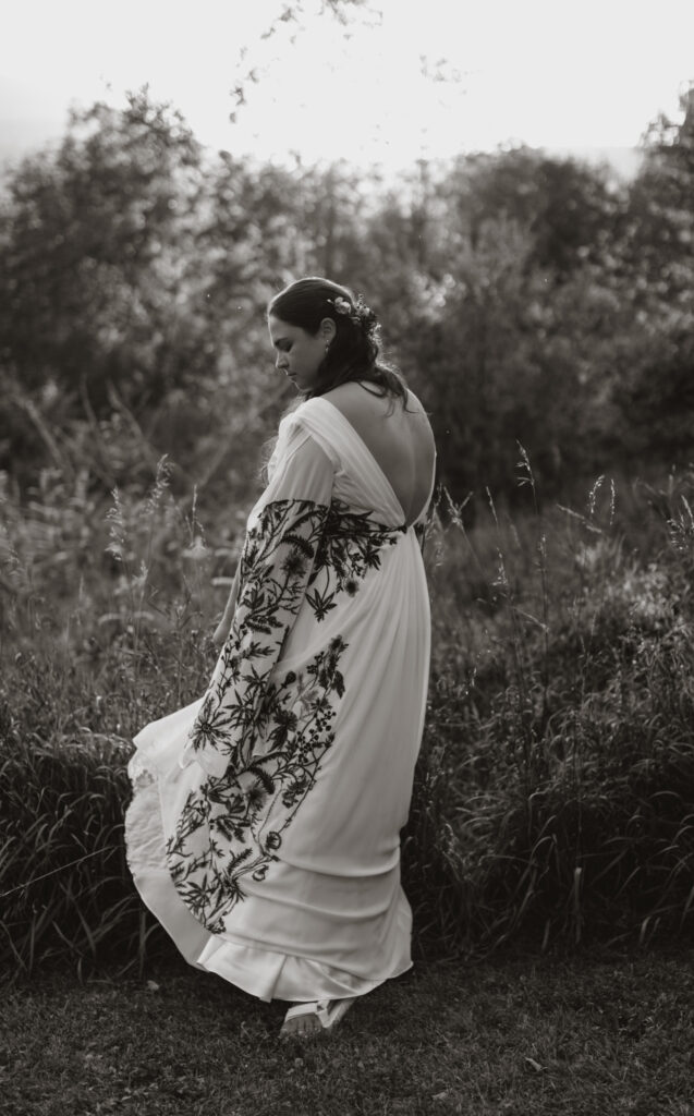 golden hour portraits in the family back yard. intimate wedding in round top new york close up of bride's reception dress