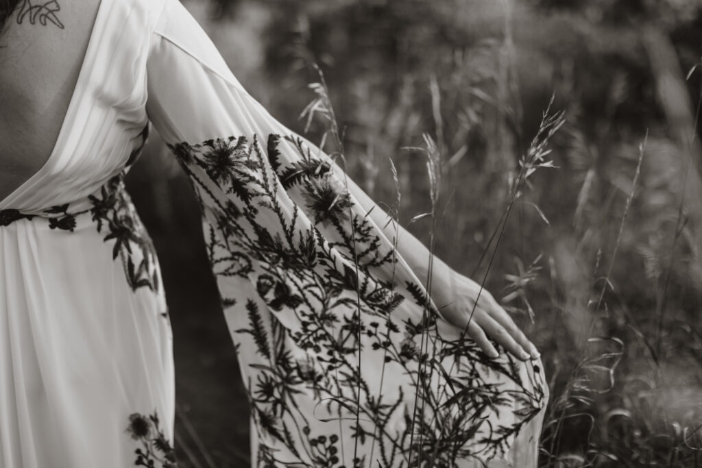 golden hour portraits in the family back yard. intimate wedding in round top new york close up of bride's reception dress