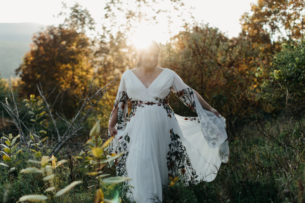 golden hour portraits in the family back yard. intimate wedding in round top new york close up of bride's reception dress