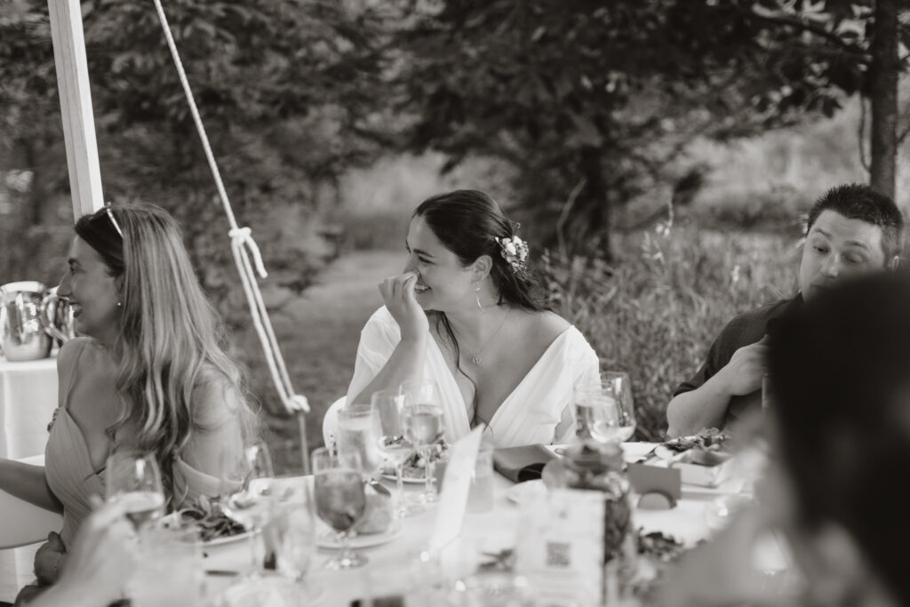 black and white shot of bride laughing