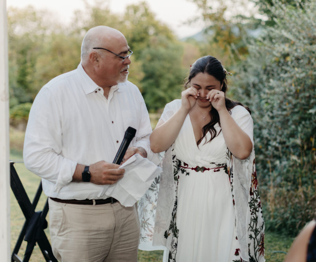 bride becomes emotional during her father's speech